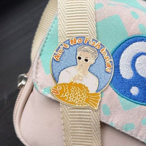 enamel pins on the bag