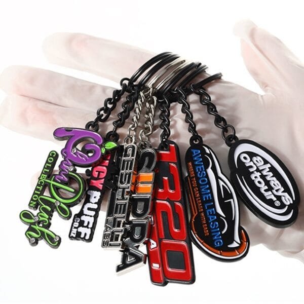 Custom keychains featuring wholesale 2D/3D metal logo and letter designs. Perfect for company key chains and enamel keyrings.